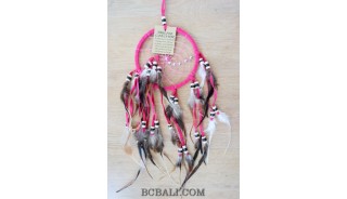 multiple feathers dream catcher with coco beads bali design pink