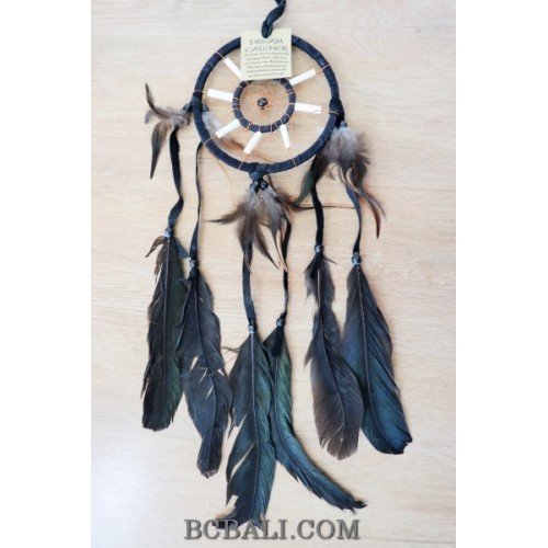 native american indiana style dream catcher with bone and feathers